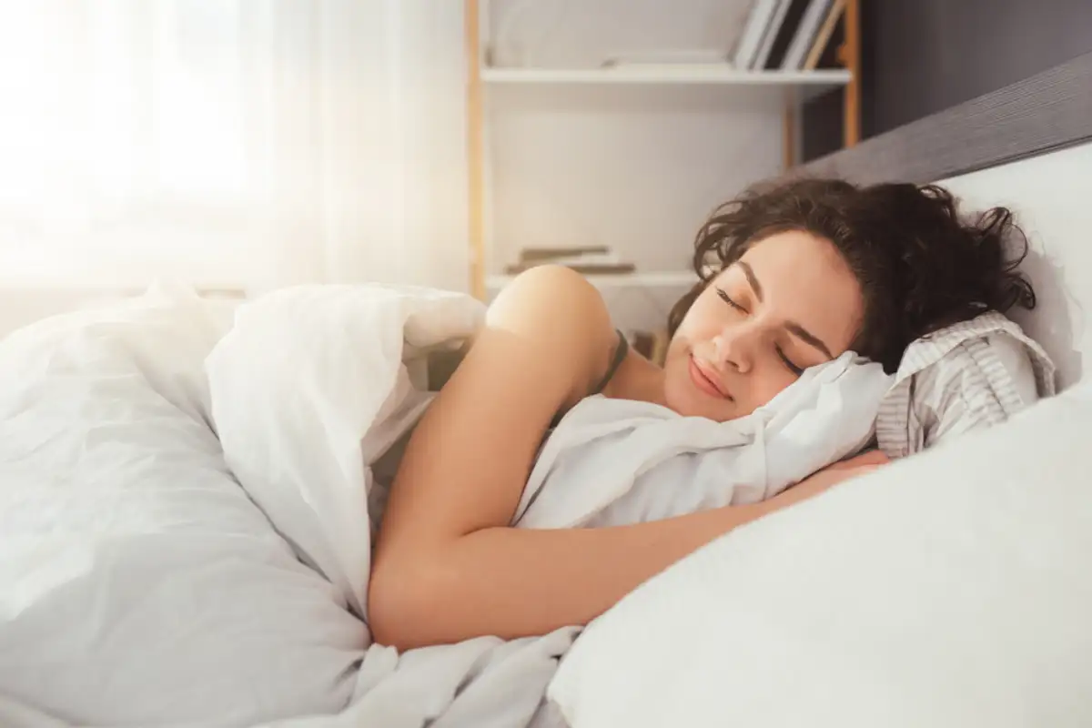 Female sleeping calmly at her bedroom