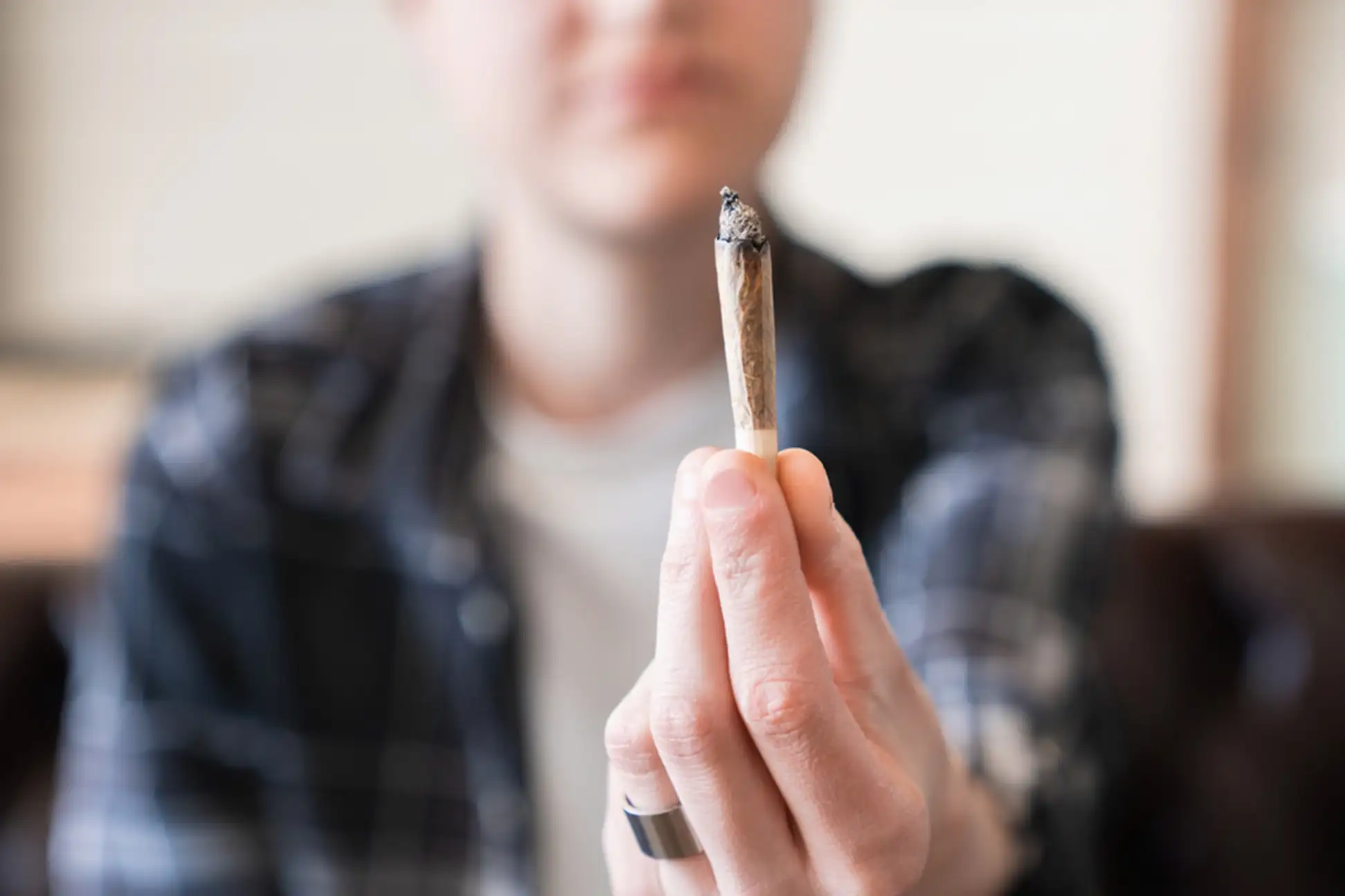 Man holding a cannabis in his hand