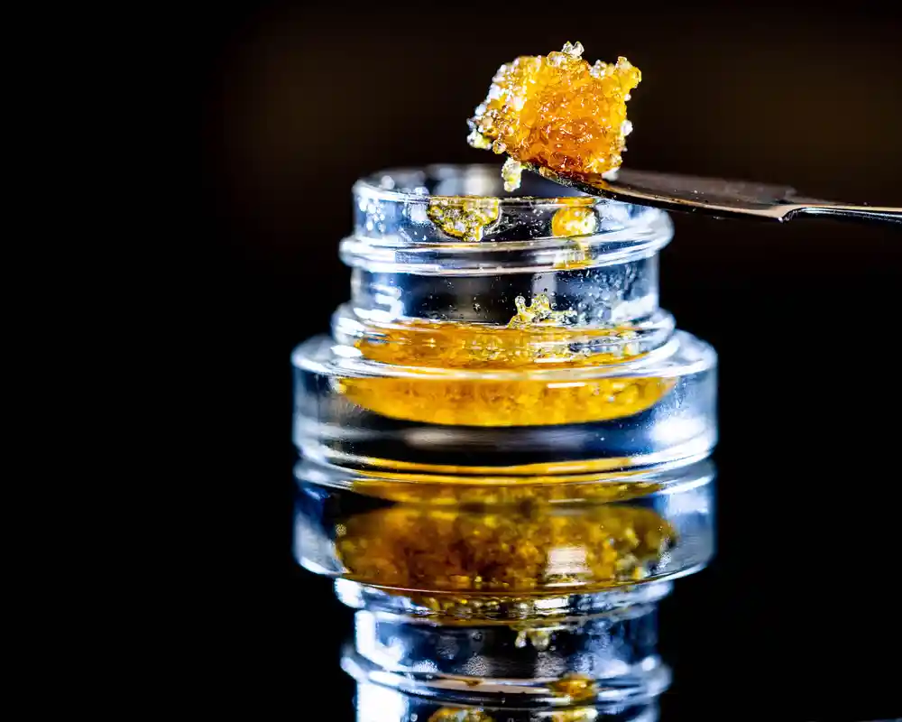 Close up of a cannabis product in a glass container