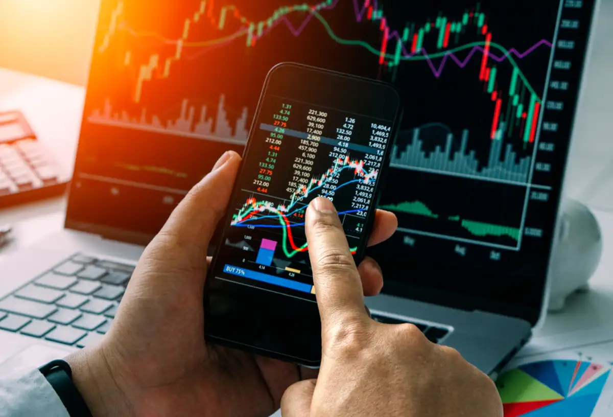 Businessman checking stock market by his smartphone