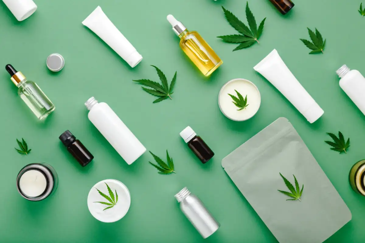 Hemp cbd oil serum in glass dropper bottle with cannabis leaves