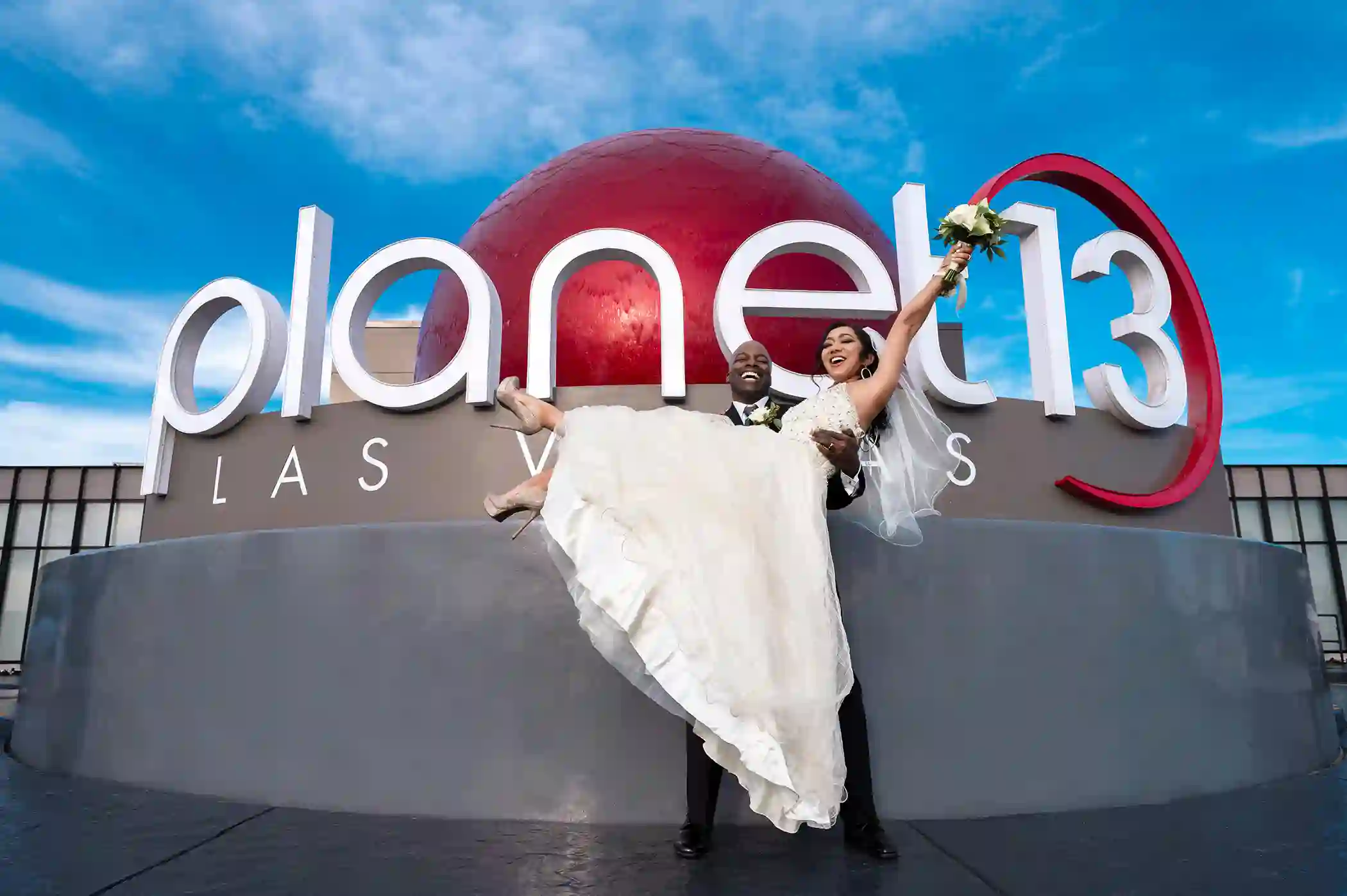 Las Vegas Cannabis Weddings couple poses outside Planet 13 after tying the knot inside the mega dispensary