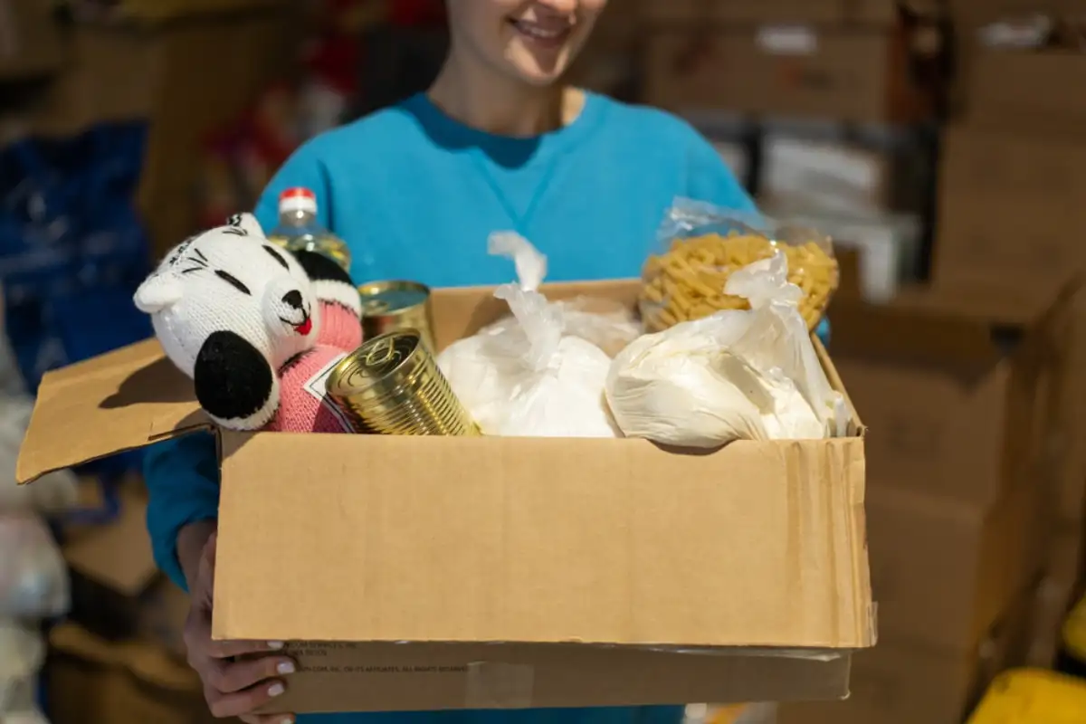 Volunteer girl preparing donation boxes